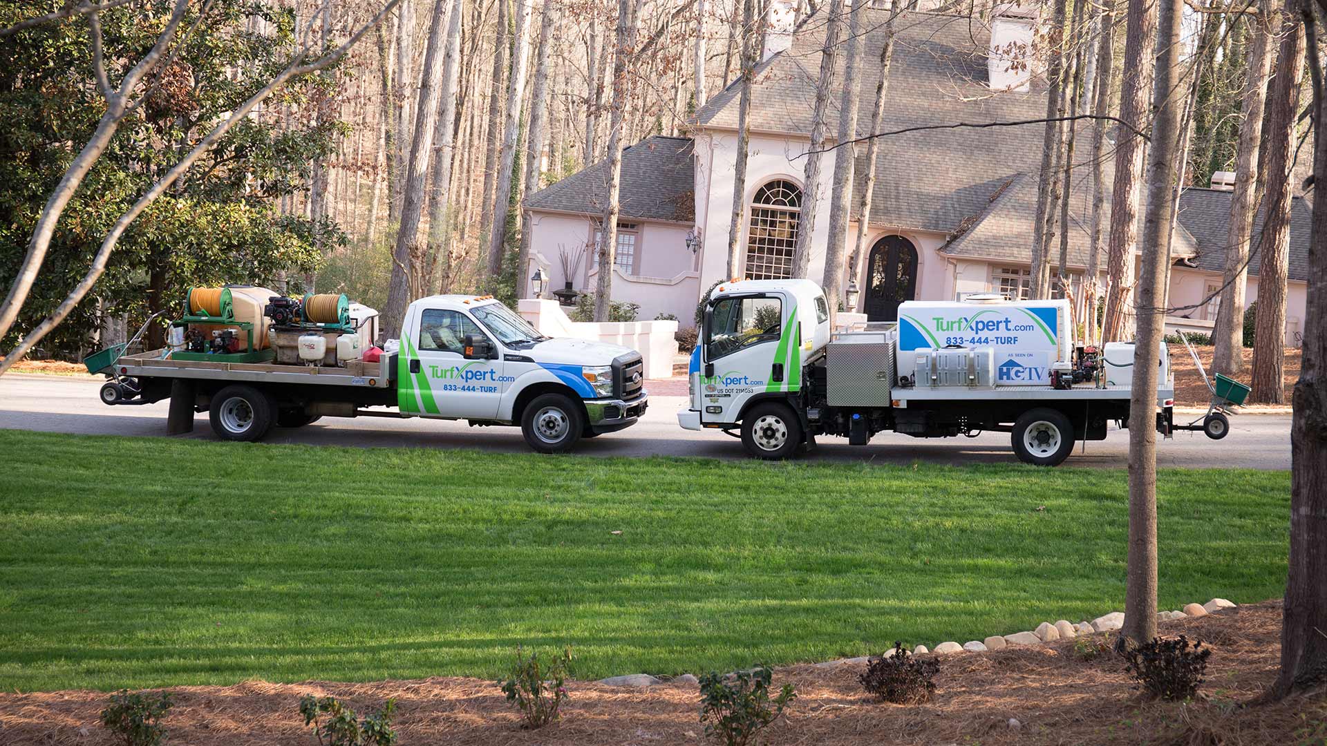 TurfXpert work crew providing lawn care to a home in Cumming, GA.