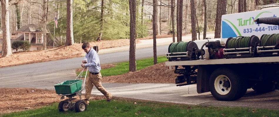 Our lawn care specialist treating a lawn for our client in Holly Springs, GA.