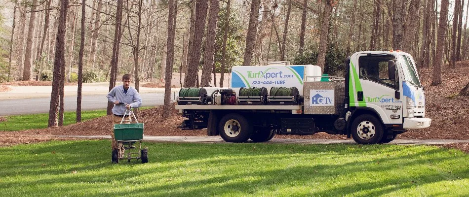 Our weed control specialist spraying a treatment on our client's lawn in Woodstock, GA.